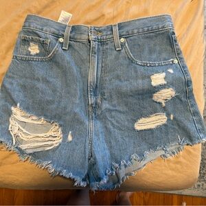 Levi’s Distressed Light Blue Denim Mom Shorts